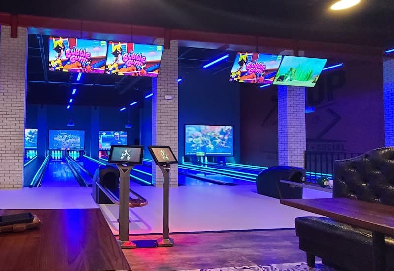 Interior view of 1UP Entertainment + Social bowling alley